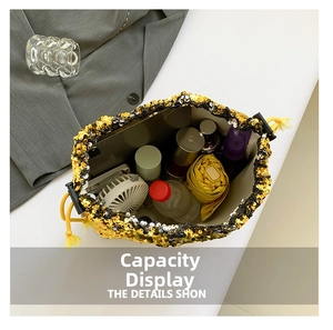 Top view display of a sequin bucket bag showing its large capacity for daily items