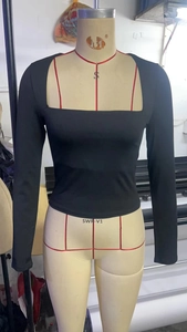 Detail view of black square neck long sleeve crop top on a professional mannequin