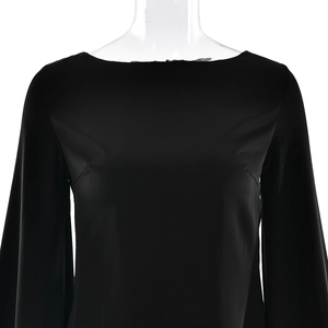 Detail of elegant black long sleeve satin dress neckline on a clear mannequin
