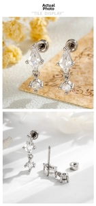Macro detail of silver rhombic kite cubic zirconia earrings with screw back studs