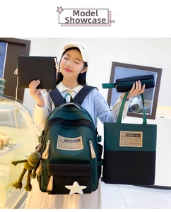 Model wearing a four-piece school backpack set in dark green and black contrast colors