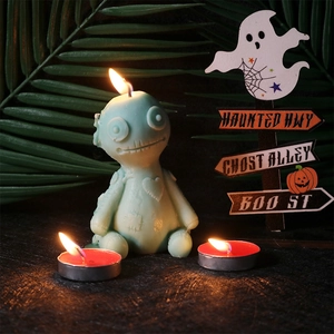 Spooky monster candle set with green voodoo doll and two red tea lights for Halloween