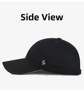 Side view of black cotton baseball cap with gold embroidery and contrast brim trim