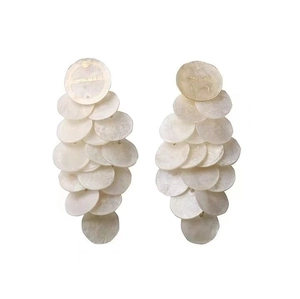 Iridescent round shell tassel earrings in layered cream white for summer beach style