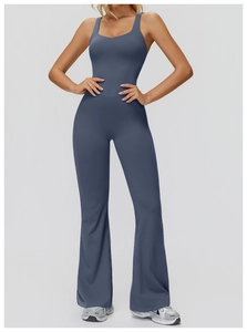 Macro detail of high-elasticity yoga jumpsuit with flared legs and crossover back design