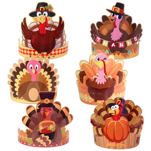 Detail view of colorful paper Thanksgiving cupcake wrappers with turkey and pumpkin designs