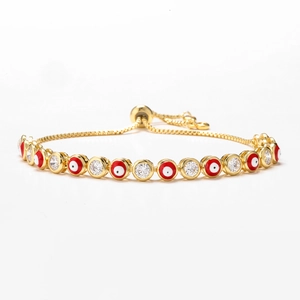 Adjustable gold evil eye bracelet with red enamel and pavé cubic zirconia accents