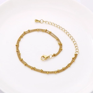 Detail of 18K gold-plated double-layer bead chain with lobster clasp and extension