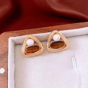 Vintage gold twisted triangle earrings with tiger eye stone and pearl in jewelry box