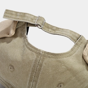 Retro washed khaki docker hat featuring adjustable metal buckle and twill cotton texture