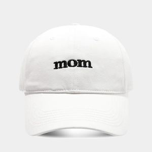 Close-up of black 'mom' letter embroidery on white cotton twill baseball cap fabric