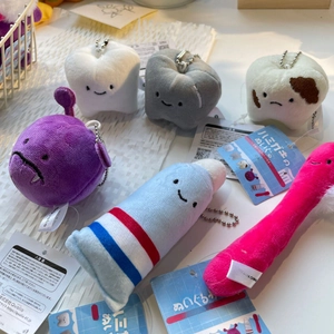 Set of 6 cute plush tooth and toothpaste keychains featuring various dental characters