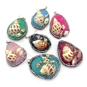 Selection of vibrant droplet shaped pendants with sea shells and sparkling rhinestones
