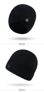 Detail view of black ribbed knit beanie featuring an interlocking silver metal logo