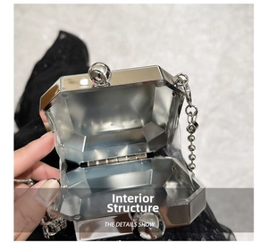 Detailed internal structure of a silver octagon metal clutch with ball clasp and chain