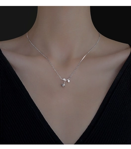 Detailed close-up of S925 sterling silver rose pendant necklace with sparkling zircons