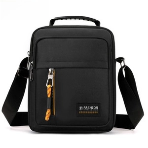 Detail of waterproof black nylon messenger bag with yellow cord zipper pull and multi-pockets