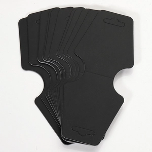 Stack of black cardboard jewelry display cards with specialized die-cut shape and hanging hole