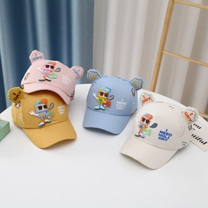 Detail of four cartoon baby baseball caps showing breathable fabric and robot embroidery