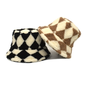 Winter lamb wool checkerboard bucket hat in black and brown plaid plush texture