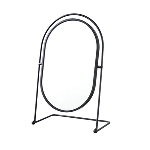 Oval tabletop makeup mirror with black iron frame and rotating stand on white background