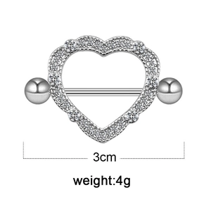 Detailed view of silver heart piercing jewelry with zircon stones and 3cm width scale
