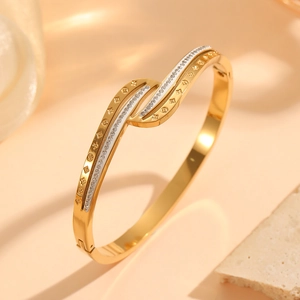 Elegant 18K gold plated titanium steel bangle with wave pattern and floral diamond inlay