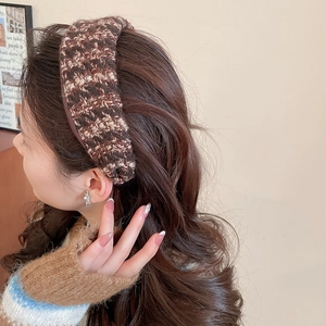Detail of tweed knit headband showing the brown and white mixed weave and soft texture
