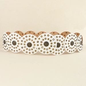 Detailed macro view of vintage white belt featuring golden metal studs and ornate medallions