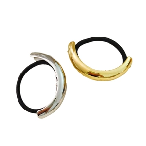 Minimalist metallic gold and silver hair cuff set with elastic bands on white background