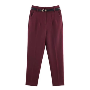 Women's burgundy high-waist straight trousers with a slim black belt on white background