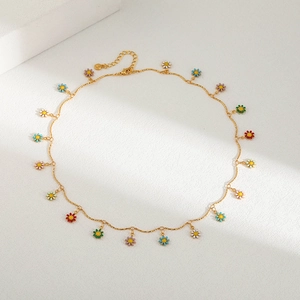 Handmade gold chain necklace with colorful enamel daisy pendants in various bright colors