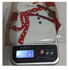 Detailed view of burlap Christmas wine bottle bag with snowman design weighing 29g