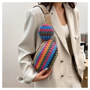 Detail of colorful woven chest bag with round coin purse on beige fabric strap