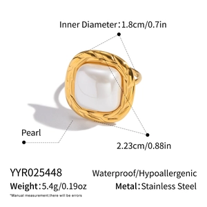 Macro view showing dimensions of a square pearl ring with golden braided stainless steel band