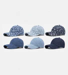 Detail of denim baseball caps collection featuring floral prints and jacquard textures