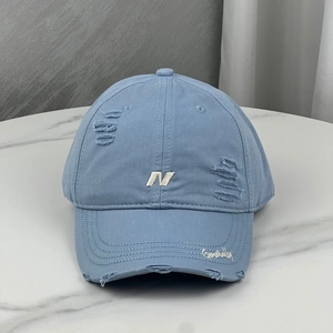 Distressed light blue baseball cap with letter N embroidery and wide curved brim