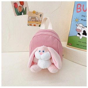 Pink canvas kids backpack featuring a cute 3D long-eared white plush bunny doll charm