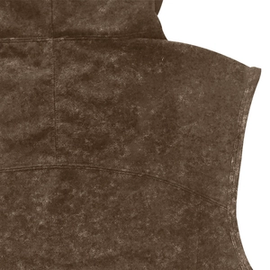 Detailed macro view of dark brown vintage distressed fabric texture and stitching on vest