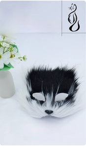 Macro detail of plush faux fur texture on black and white cat masquerade mask