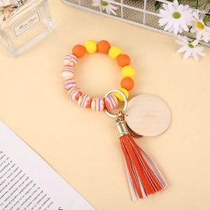Buntes Silikon-Perlenarmband-Schlüsselanhänger mit Holzscheibe und Lederquaste