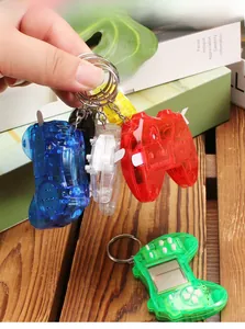 Mini retro handheld game console keychain with transparent case and internal circuits