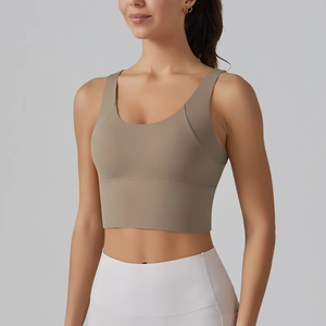 Detail of V-back sports bra in taupe with wide straps and high-support elastic band
