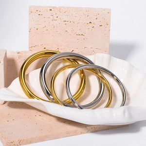 Minimalist 18k gold and silver hollow stainless steel bangles set in shell decor