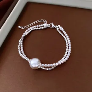 Double-layered pearl and faceted silver bead bracelet with adjustable lobster clasp