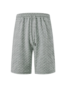 Detailed view of grey jacquard men's shorts showing herringbone texture and drawstring