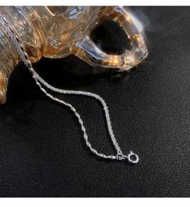 Detail of silver-plated double-layer bracelet showing polished beads and shimmering texture
