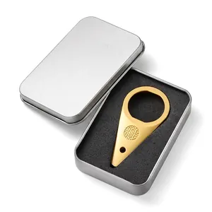 Detailed view of the gold vintage bottle opener inside a premium tin gift box set
