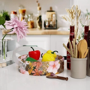 Macro detail of round resin bucket mold with floral pattern and transparent handle