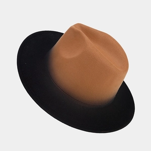 Detail of elegant two-tone gradient wool fedora hat with camel crown and black brim